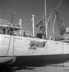 Painting the hull of a ship in the harbour of Gothenburg, Sweden, 1960. Artist: Torkel Lindeberg