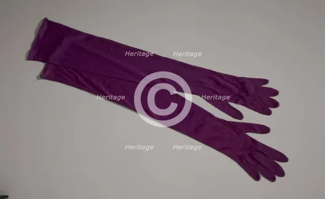 Pair of arm length purple gloves from Mae's Millinery Shop, 1941-1994. Creator: Van Raalte.