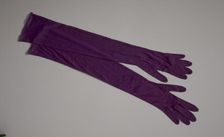 Pair of arm length purple gloves from Mae's Millinery Shop, 1941-1994. Creator: Van Raalte