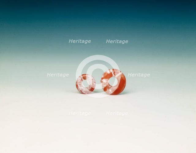 Pair of cornelian flat bi-discs, neolithic, Liangzhu culture, China, c3400-2250 BC. Creator: Unknown.