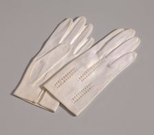 Pair of light cream gloves with openwork design from Mae's Millinery Shop, 1941-1994. Creator: Van Raalte