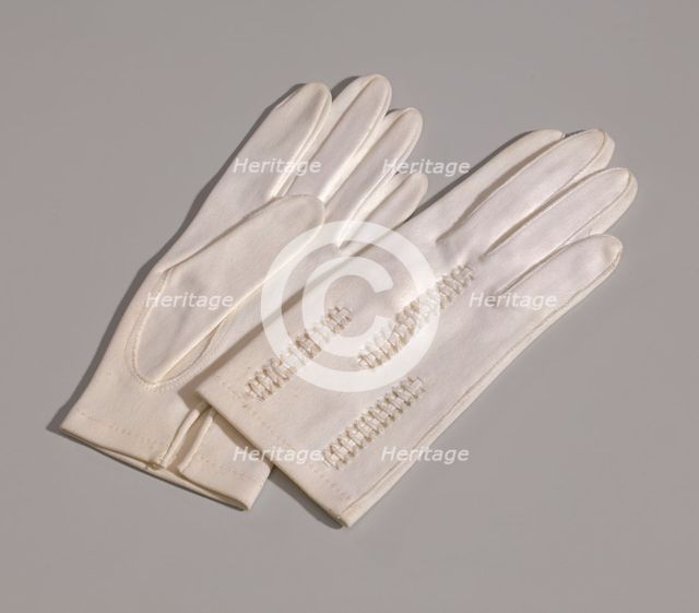 Pair of light cream gloves with openwork design from Mae's Millinery Shop, 1941-1994. Creator: Van Raalte.