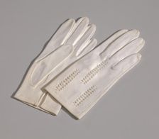 Pair of light cream gloves with openwork design from Mae's Millinery Shop, 1941-1994. Creator: Van Raalte