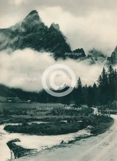 Pala Group in clouds, San Martino di Castrozza, Dolomites, Italy, 1927. Artist: Eugen Poppel.