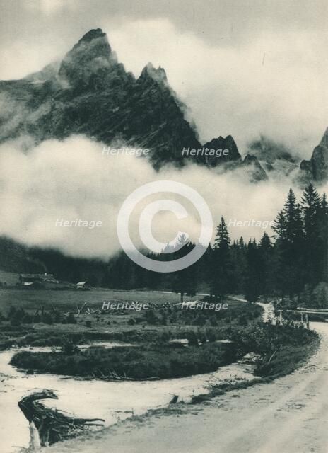 Pala Group in clouds, San Martino di Castrozza, Dolomites, Italy, 1927. Artist: Eugen Poppel.