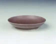 Pale aubergine glazed saucer, Yongzheng period, Qing dynasty, China, 1723-1735. Creator: Unknown
