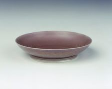 Pale aubergine glazed saucer, Yongzheng period, Qing dynasty, China, 1723-1735. Creator: Unknown