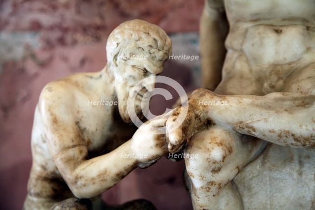 Pan and satyr, Pan removing a splinter from a satyr's foot. Artist: Unknown