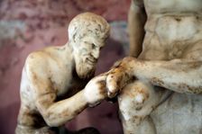 Pan and satyr, Pan removing a splinter from a satyr's foot