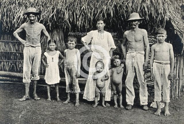 Panama Indian family outside a traditional hut,  1900/1910. Creator: Unknown.