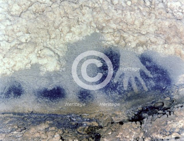 Panel of the points horses (Paintings Room, Pech-Merle Cave): detail of a hand in negative in bla…