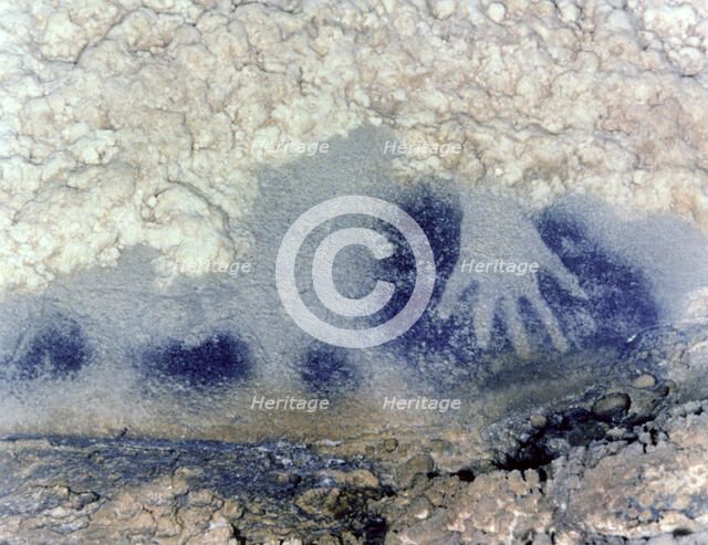 Panel of the points horses (Paintings Room, Pech-Merle Cave): detail of a hand in negative in bla…