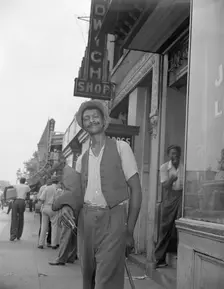 Panhandler on 7th Street, N.W., Washington, D.C., 1942. Creator: Gordon Parks