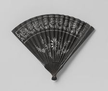 Paper mourning fan with white floral motif..., c.1850-c.1899. Creator: Anon