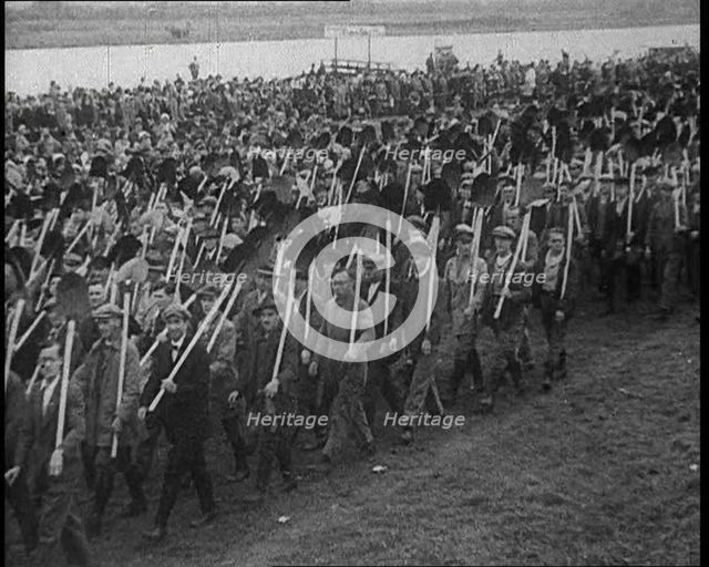 Parade of German Men with Spades and Shovels, 1933. Creator: British Pathe Ltd.
