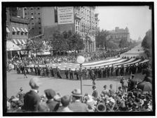 Parade On Pennsylvania Ave - Huge Flag, between 1910 and 1921. Creator: Harris & Ewing