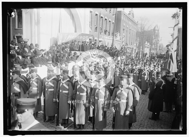 Parade with President Woodrow Wilson and Mrs. Wilson on reviewing stand, between 1910 and 1914. Creator: Harris & Ewing.