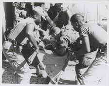 Paratrooper from the 101st Airborne Brigade applying mouth-to-mouth resuscitation..., 1967. Creator: United States Army