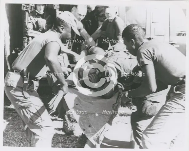 Paratrooper from the 101st Airborne Brigade applying mouth-to-mouth resuscitation..., 1967. Creator: United States Army.