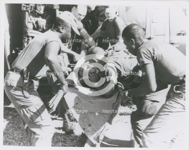 Paratrooper from the 101st Airborne Brigade applying mouth-to-mouth resuscitation..., 1967. Creator: United States Army.
