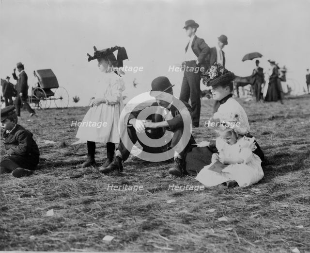 Parents and children seated on grass at state fair, St. Paul, Minnesota, 1900?. Creator: Unknown.