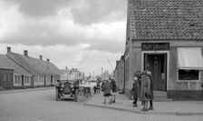 Parked car and children on a street corner, Landskrona, Sweden, 1925