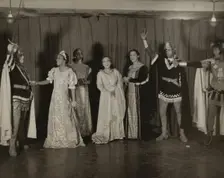 Parker Watkins with raised sword, and others, 1936. Creator: Eagle Ezzes & Mipaas