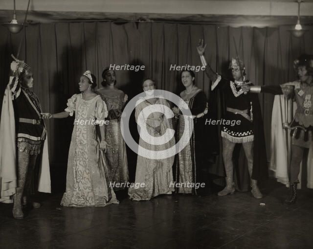 Parker Watkins with raised sword, and others, 1936. Creator: Eagle Ezzes & Mipaas.