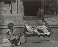 Park Avenue - Young girl selling clothes on the street, East Harlem, New York City, 1947 - 1951. Creator: Romulo Lachatanere