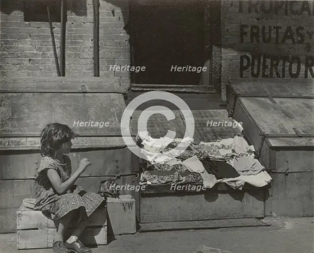 Park Avenue - Young girl selling clothes on the street, East Harlem, New York City, 1947 - 1951. Creator: Romulo Lachatanere.