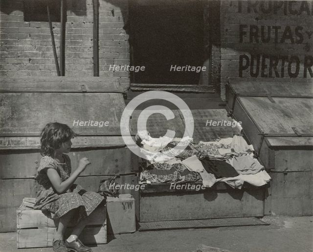 Park Avenue - Young girl selling clothes on the street, East Harlem, New York City, 1947 - 1951. Creator: Romulo Lachatanere.
