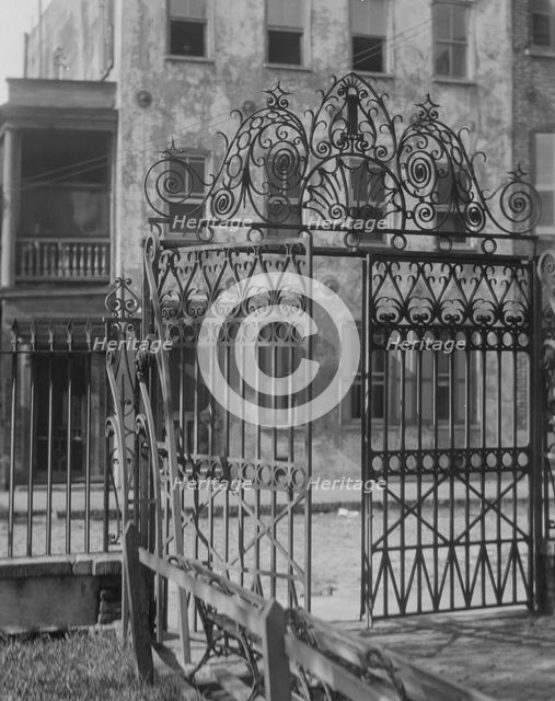 Park gate and houses, [36 Chalmers Street through Washington Park Gate], Charleston..., c1920-c1926. Creator: Arnold Genthe.