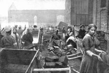 'Parmi les populations delivrees; A caudry; habitants venus chercher les vivres..., 1918. Creator: Unknown