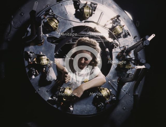 Part of the cowling for one of the motors for a B-25...North American Aviation, Inglewood, CA., 1942 Creator: Alfred T Palmer.