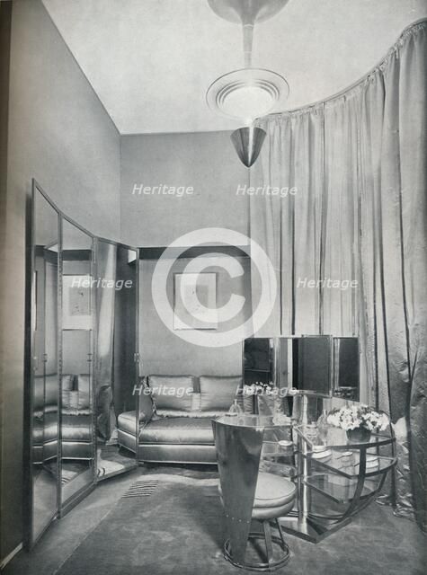 'Part of a boudoir dressing-room in dove grey satin and chromium plated metal, by Eugene Printz of P Artist: Unknown.