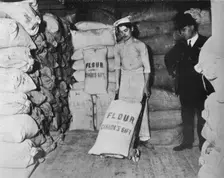 Part of Canada's gift of flour of the relief of war distress in England 1915