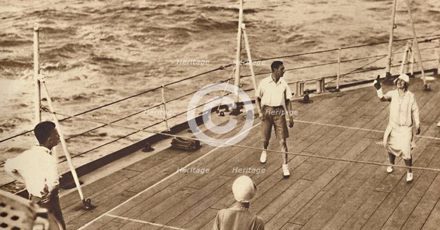 'Partners - A game of deck tennis in the Renown', 1927, (1937). Creator: Unknown.