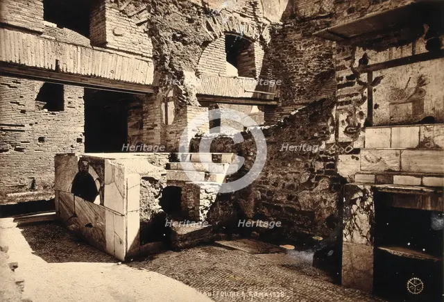 Partly ruined buildings in Ostia identified as a tavern or hot-food shop (thermopolium)..., 1928. Creator: Unknown.