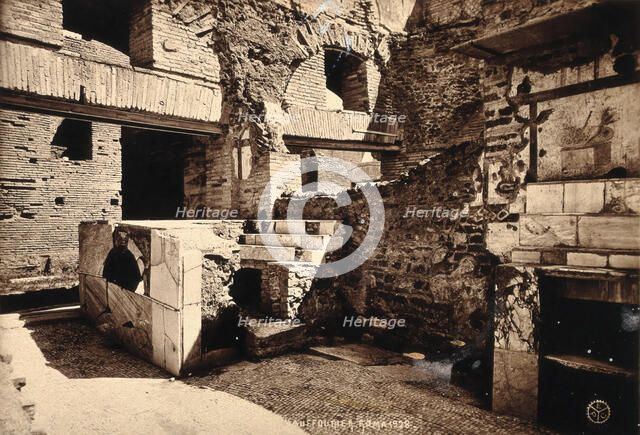 Partly ruined buildings in Ostia identified as a tavern or hot-food shop (thermopolium)..., 1928. Creator: Unknown.