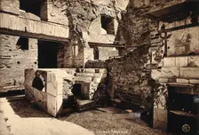 Partly ruined buildings in Ostia identified as a tavern or hot-food shop (thermopolium)..., 1928. Creator: Unknown