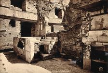 Partly ruined buildings in Ostia identified as a tavern or hot-food shop (thermopolium)..., 1928. Creator: Unknown