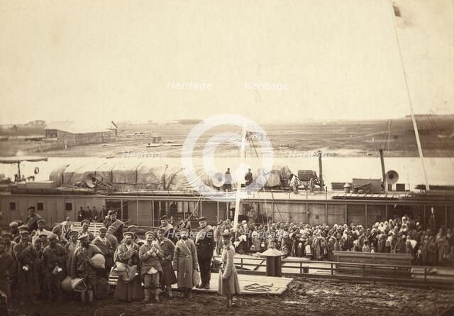 Party of exiles and convicts embarking on river barge at Tumen [ie, Tiumen]..., between 1885 and 86. Creator: Unknown.