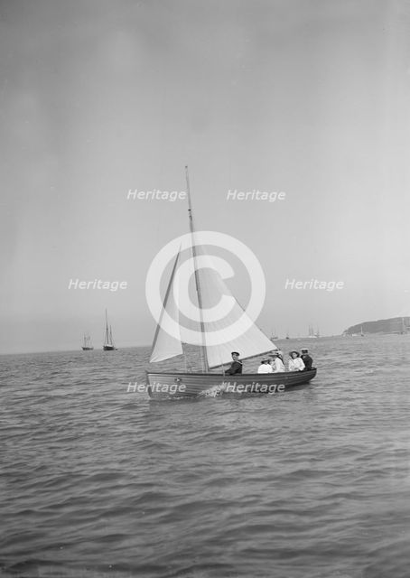 Party sailing on the Earl of Normanton's Cutter, 1911. Creator: Kirk & Sons of Cowes.