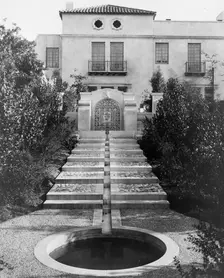 Pasadena, California, Mrs. Herbert Coppell home - pond at foot of long stairway leading..., 1917. Creator: Frances Benjamin Johnston