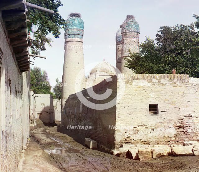 Passageway and three minarets topped with birds' nests, between 1905 and 1915. Creator: Sergey Mikhaylovich Prokudin-Gorsky.