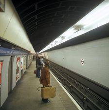 Passengers waiting at Blackhorse tube station on the Victoria Line, London, 1974. Artist: Michael Walters