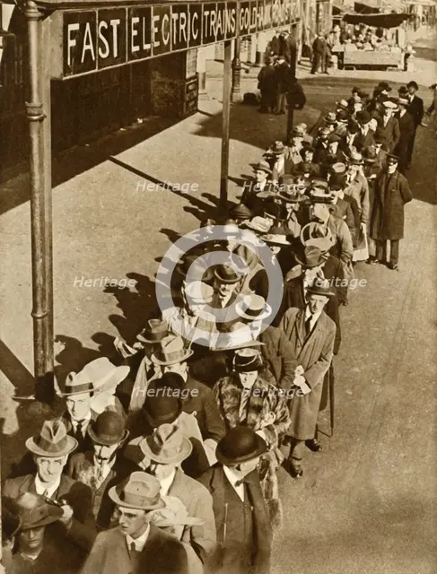 Passengers waiting at Goldhawk Road Station in London during the railway strike, 1919, (1935). Creator: Unknown.