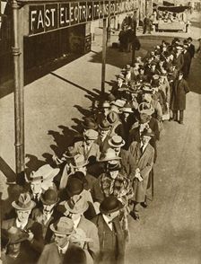 Passengers waiting at Goldhawk Road Station in London during the railway strike, 1919, (1935). Creator: Unknown