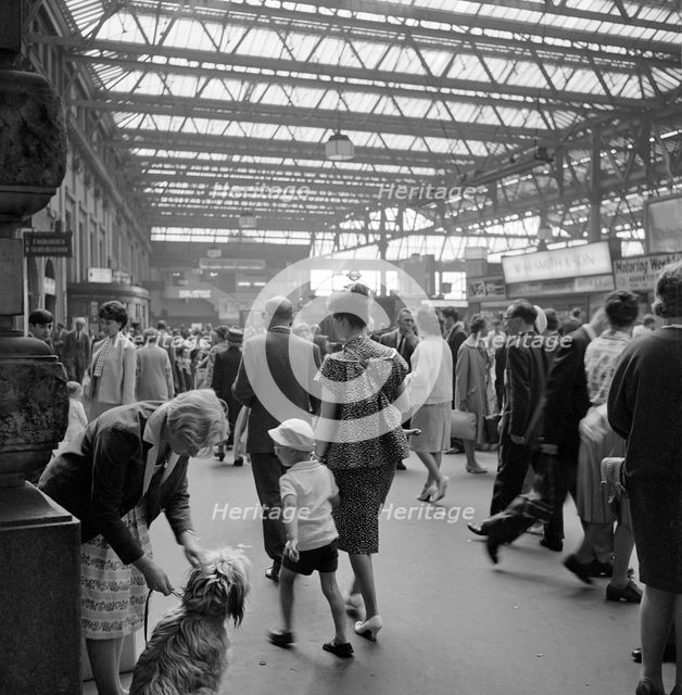 Passengers at Waterloo Station, London, 1962-1964. Artist: John Gay