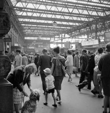 Passengers at Waterloo Station, London, 1962-1964. Artist: John Gay